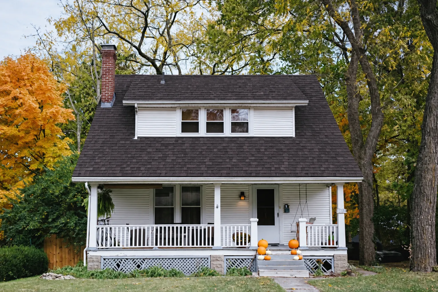 After: the same house with a clean new shingle roof